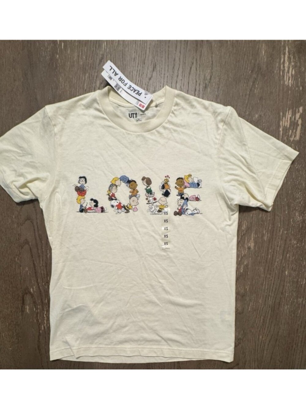 Uniqlo x Peanuts NWT Peace For all Graphic t shirt LOVE SPELL OUT XS Yellow